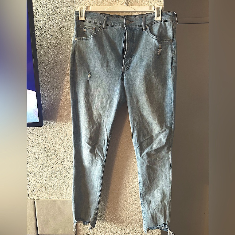 Light blue express jeans/ well worn/a loose thread on right back pocket
